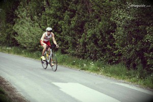 © triaguide.com. On the bike after the transition.